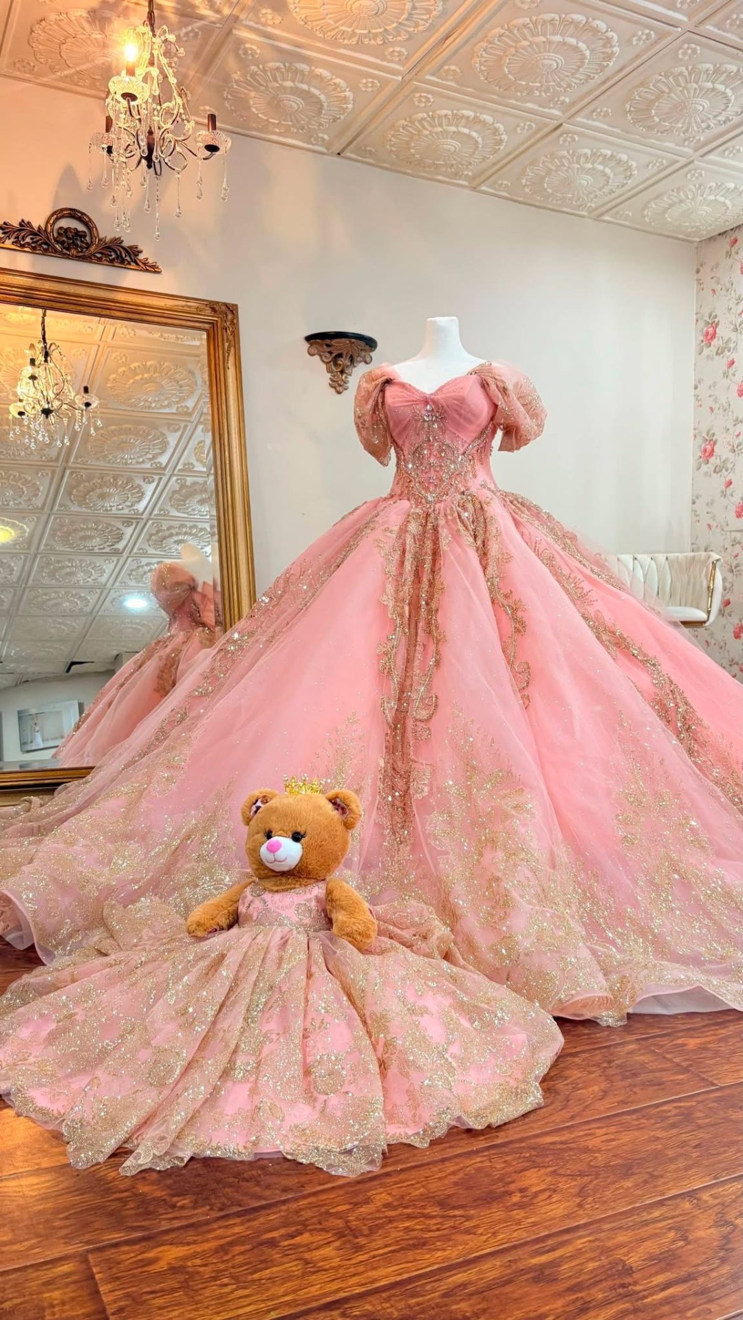 Pink and gold quinceañera gown on display
