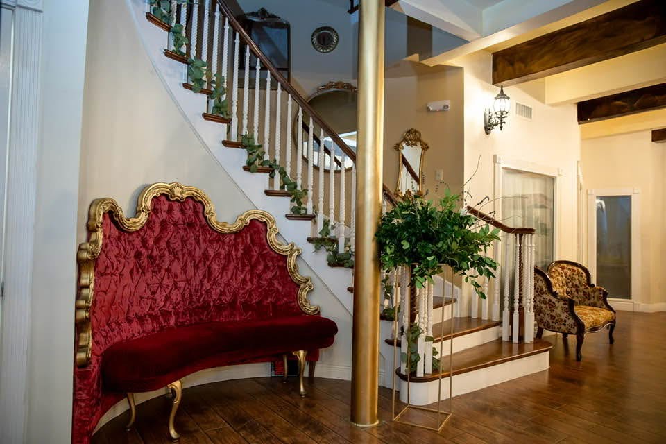 Staircase with red velvet lounge seating