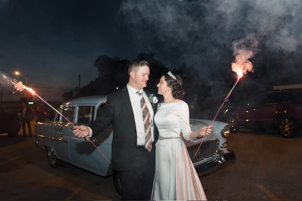 Sparkler send-off with vintage car
