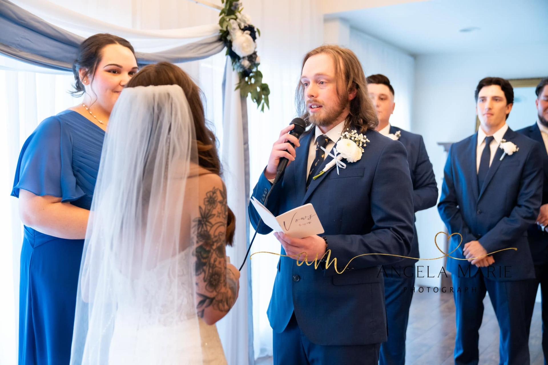 Groom reading vows to the bride at the altar
