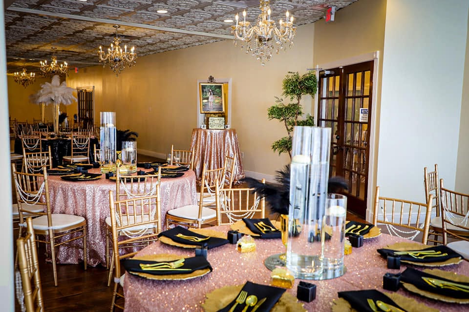 Gatsby-inspired reception with pink sequin linens, gold chargers, and feathers